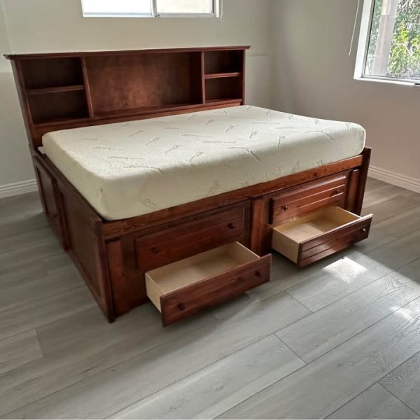 Wooden full-size platform bed with bookcase and twin trundle bed